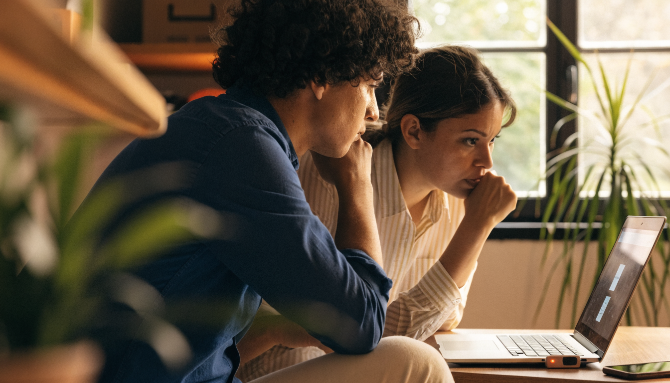 Small business owner checking a list of what a small business should do for cybersecurity awareness month (image for: what should a small business do for cybersecurity awareness month)